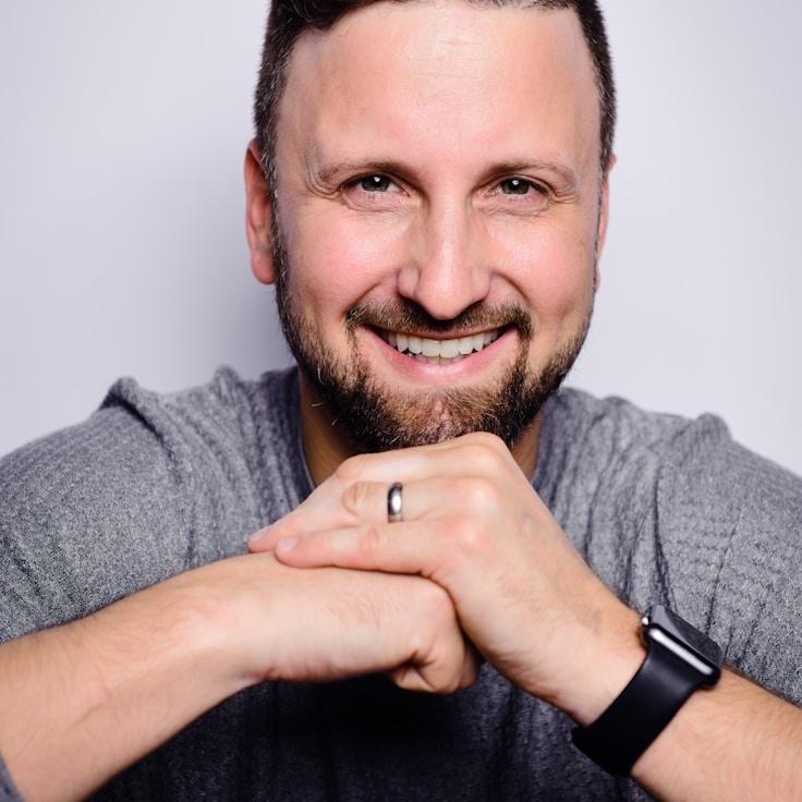 Alex Kim, Lead Design Curator at CanyonCliffDune, reviewing corporate floral arrangements